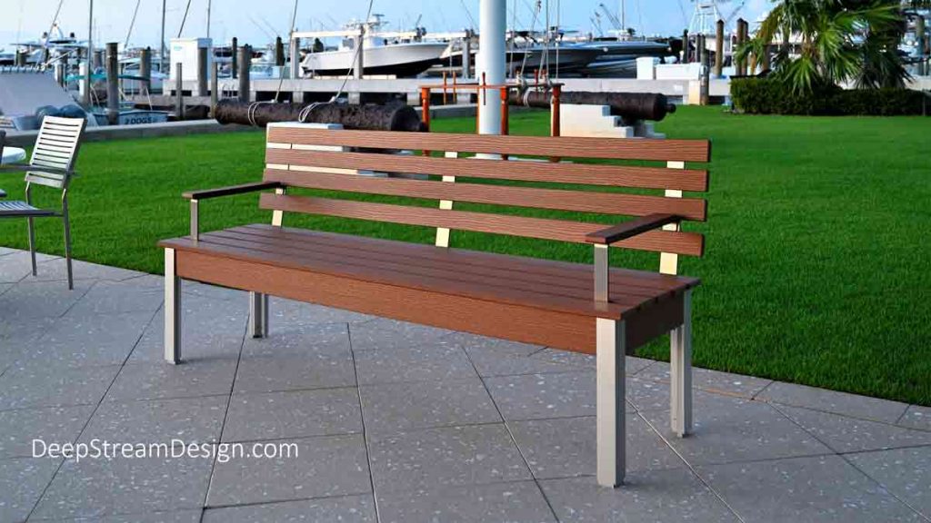 The Perfect Outdoor Bench with Back in recycled rich Tropical Hardwood plastic lumber and marine anodized aluminum make it great choice at this yacht club.